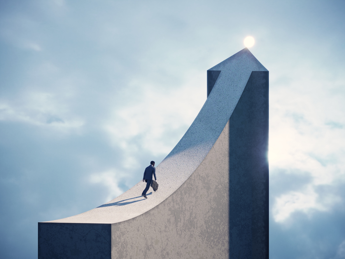 Business man running on arrow-shaped bridge to the light